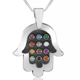 Hamsa pendant with 12 natural Hoshen stones – spiritual power and timeless elegance.