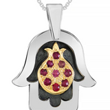 Unique silver pendant featuring a Hamsa design combined with a 9K gold pomegranate, set with natural ruby stones.