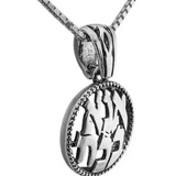 Delicate silver pendant with the inscription “Ana BeKoach.”