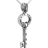 Silver pendant in the shape of a key, engraved with the words “Woman of Valor.”