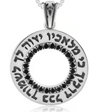 Silver “Ki Malachav” pendant with onyx stone settings around it.