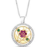 “The Pomegranate” pendant — silver combined with gold, adorned with gemstone inlays.