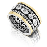 Silver and gold spinning ring set with white zircon stones.