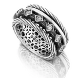 Silver spinning ring set with zircon stones.
