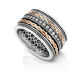 Silver spinning ring combined with rose gold and set with zircon stones.