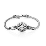 Silver bracelet featuring a decorated head design engraved with the combination A.L.D